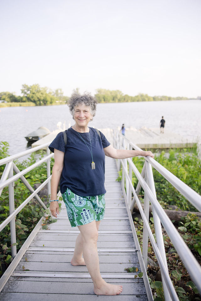 Hannah Bright Turquoise Hamsa Pattern on Dark Green Swim Trunks