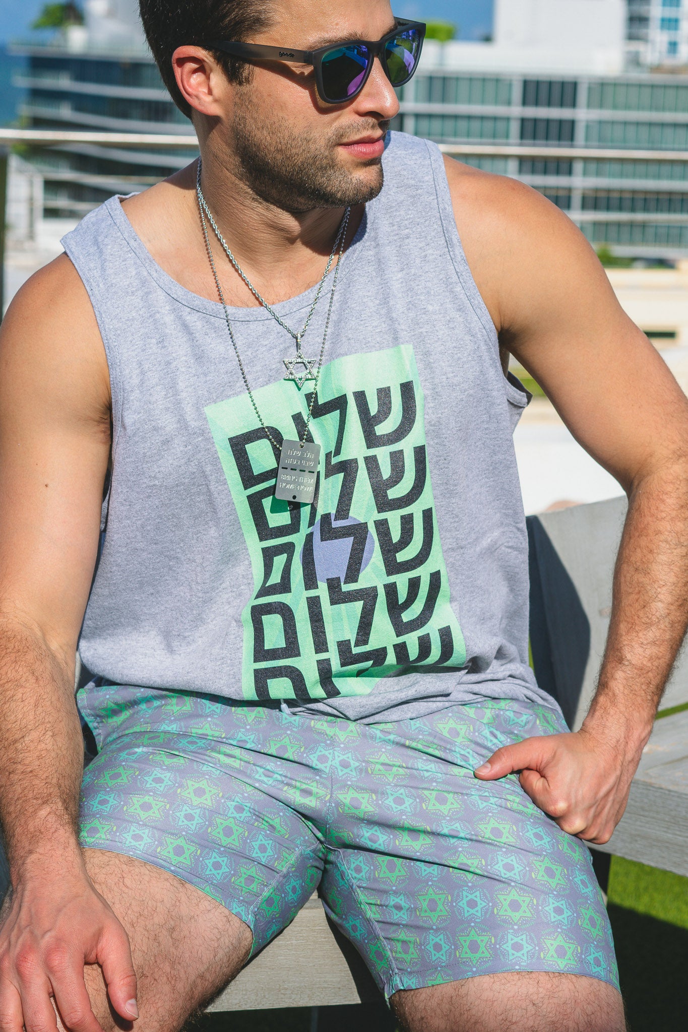 Yechiel Green on Gray Star Swim Trunks